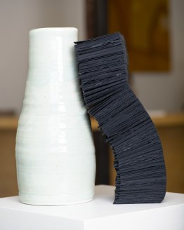 Lara Head, "Two vessels,” 2019. Porcelain, Khadi black rag paper and waxed linen thread.