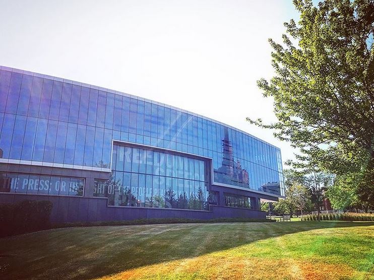 Crouse College reflected in Newhouse 3 windows