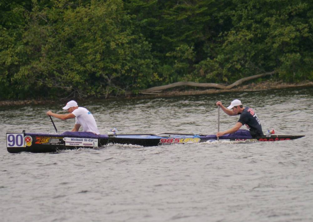 two men in canoe paddling