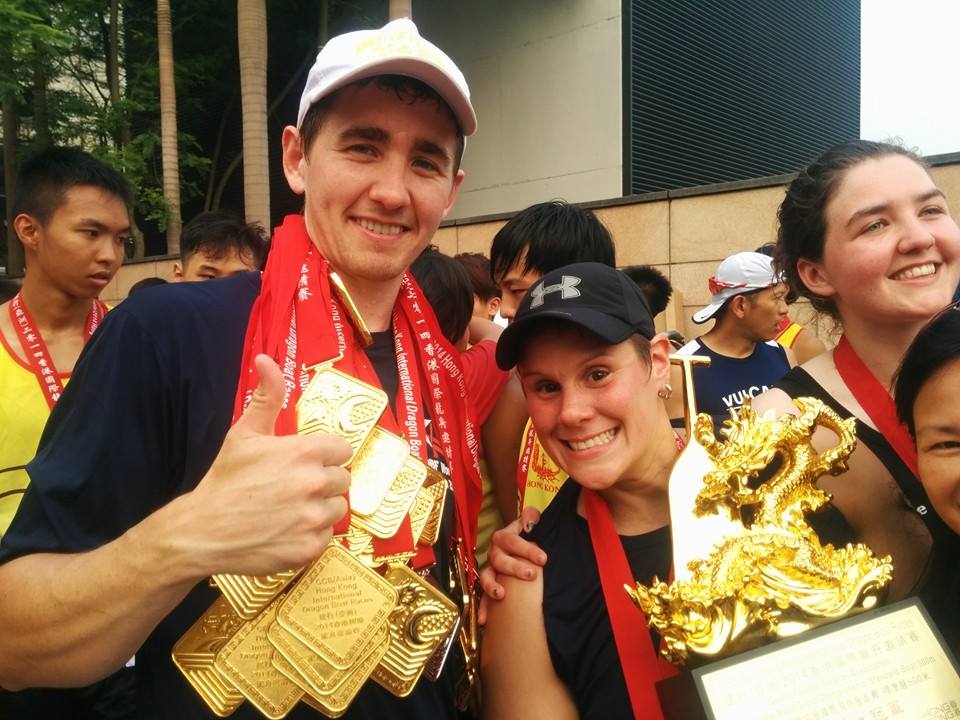 man and woman with medals around their necks