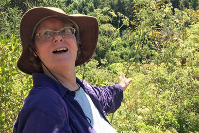 sal levinson smiles and points to a plant on the tour