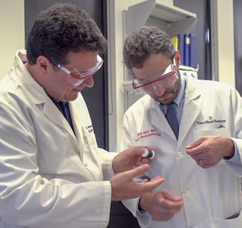 Rice University Professor Matteo Pasquali, left, and Dr. Mehdi Razavi of the Texas Heart Institute check a thread of carbon nanotube fiber invented in Pasquali's Rice lab. They are collaborating on a method to use the fibers as electrical bridges to restore conductivity to damaged hearts. (Credit: Texas Heart Institute)