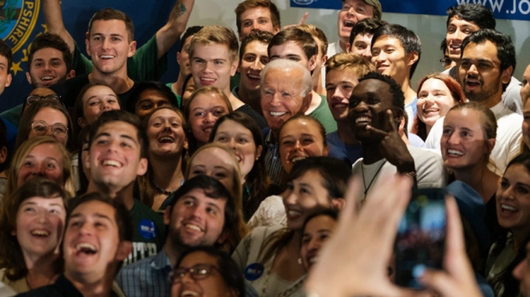 Former Vice President Joe Biden (D-Del.) poses for a group selfie with Dartmouth students after his town hall event in Alumni Hall in August. 