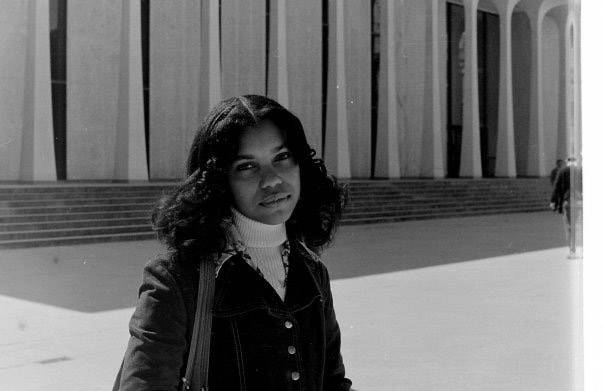 Ivy Thomas in front of Robertson Hall 