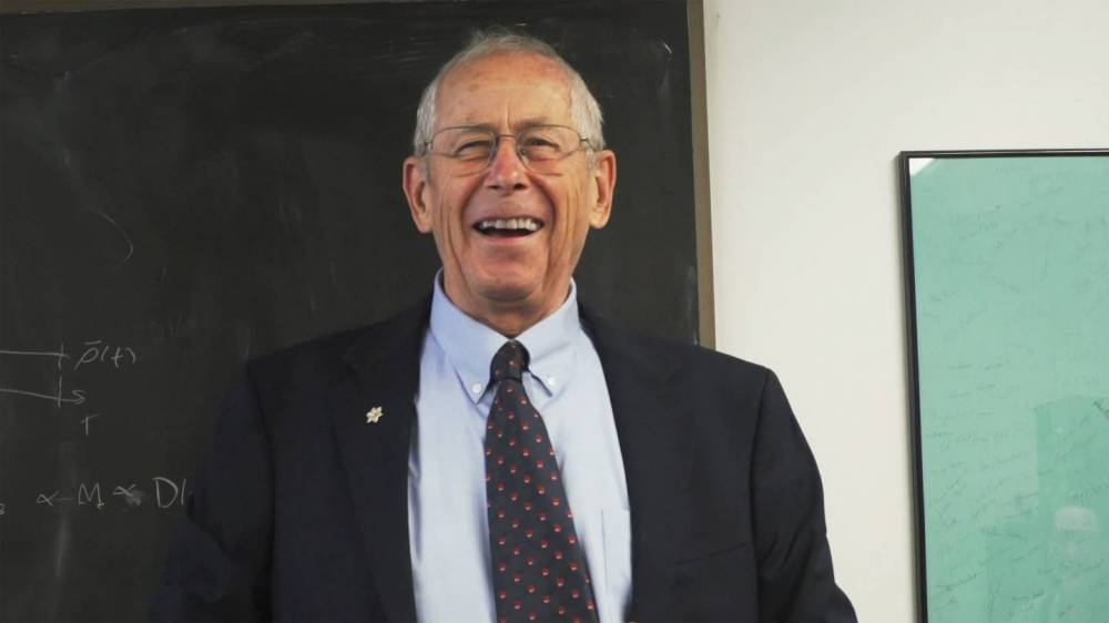 James Peebles reacts with joy as he is congratulated on his Nobel Prize