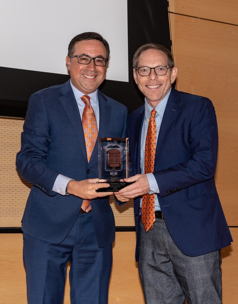 two people holding award