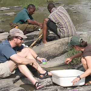 Post in the field taking river samples