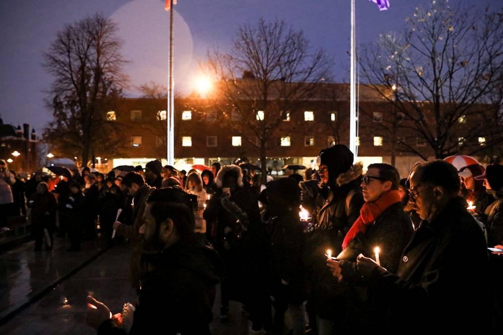 group of people holding candles