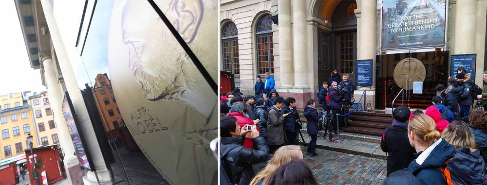 A crowd gathers outside the Nobel Museum to catch a glimpse of the laureates as they attend a private welcoming ceremony Friday