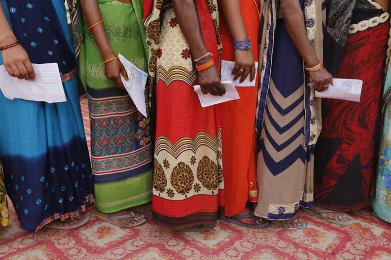 Indians wait in a queue to cast their votes at a polling station in Kachanar on the outskirts of in Varanasi, India Sunday, May 19, 2019. Indians voted in the seventh and final phase of national elections Sunday, wrapping up a 6-week-long long, grueling campaign season with Prime Minister Narendra Modi's Hindu nationalist party seeking reelection for another five years. AP Photo/Rajesh Kumar Singh