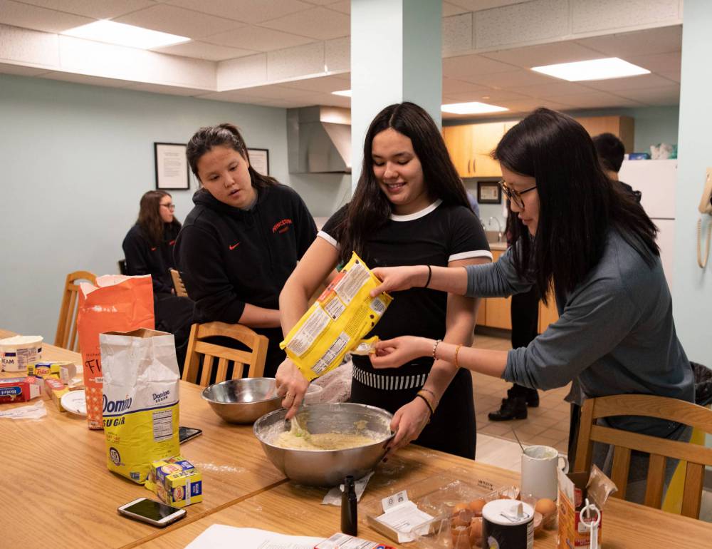 Students mixing batter for banana bread