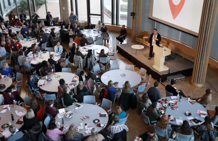 Vice Provost Adrienne Davis, the William M. Van Cleve Professor of Law and director of the Center for the Study of Race, Ethnicity & Equity, addresses a full house in Hillman Hall to kick off the second day of programming at Day of Dialogue & Action. (Photo: James Byard/Washington University)