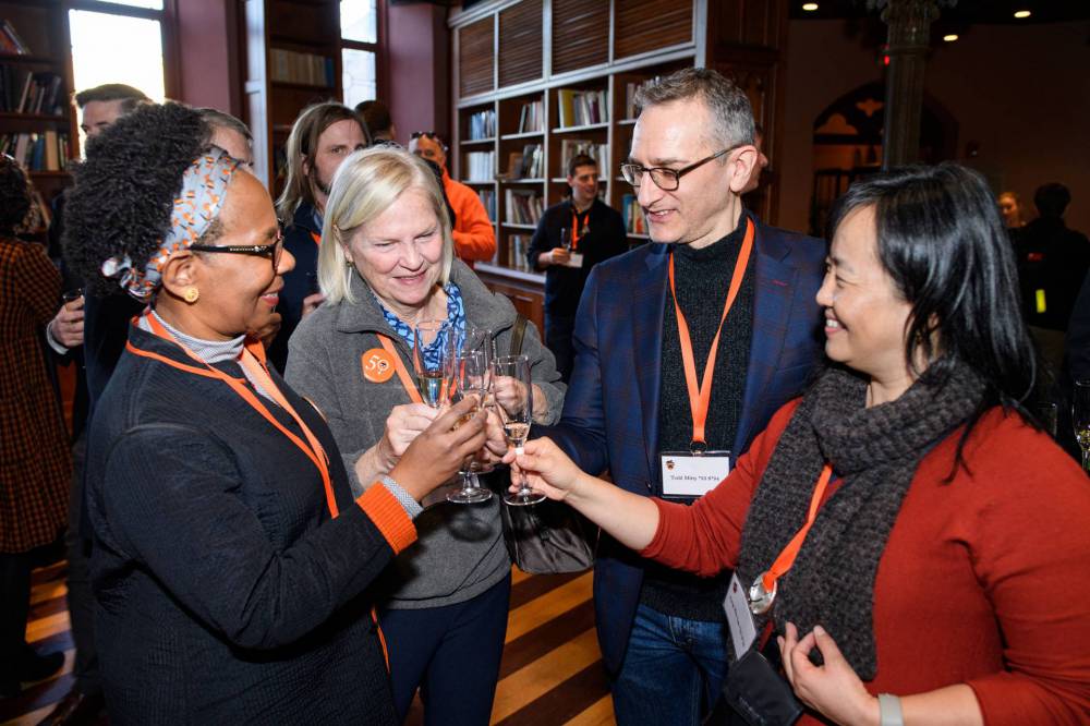 Princeton alumni toast in honor of the 50th anniversary of undergraduate coeducation