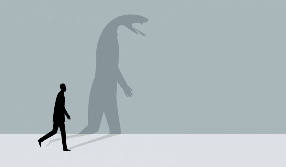 An illustration of a man walking, and his shadow shows the figure of a snake. Credit: iStock/dane_mark