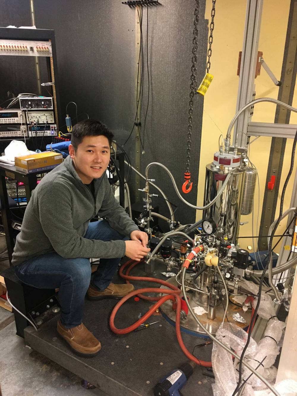 A graduate student with scientific equipment